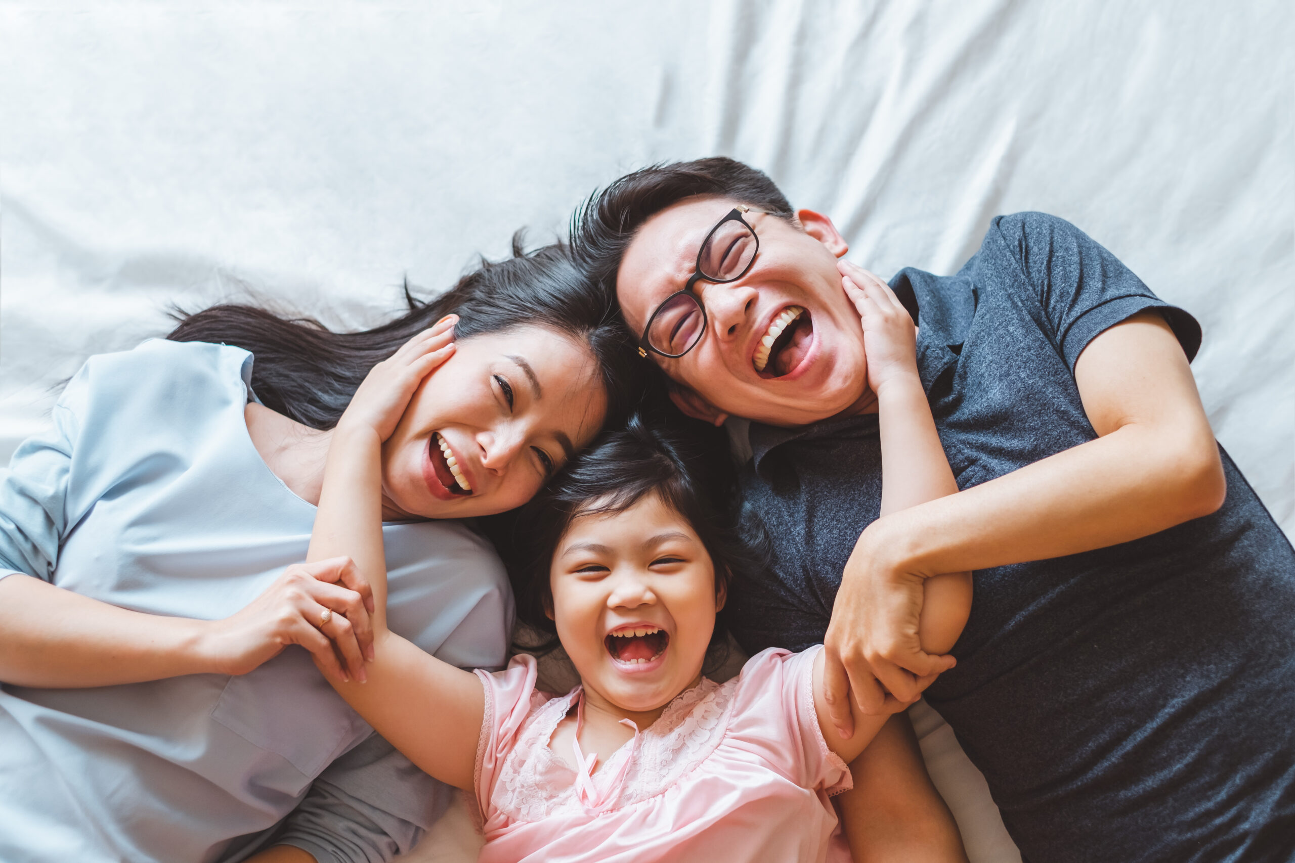Asian family smiling after appointment at Global Smiles Dental in Indianapolis