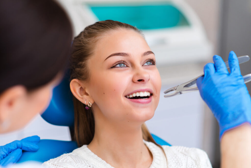 Female patient tooth extraction at Global Smiles Dental in Indianapolis