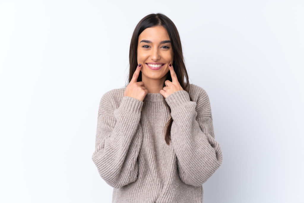 Patient smiling and displaying teeth after years of getting preventative dentistry done at Global Smiles Dental in Indianapolis